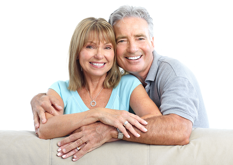 happy senior couple with dental implants from Plessis Dental Centre